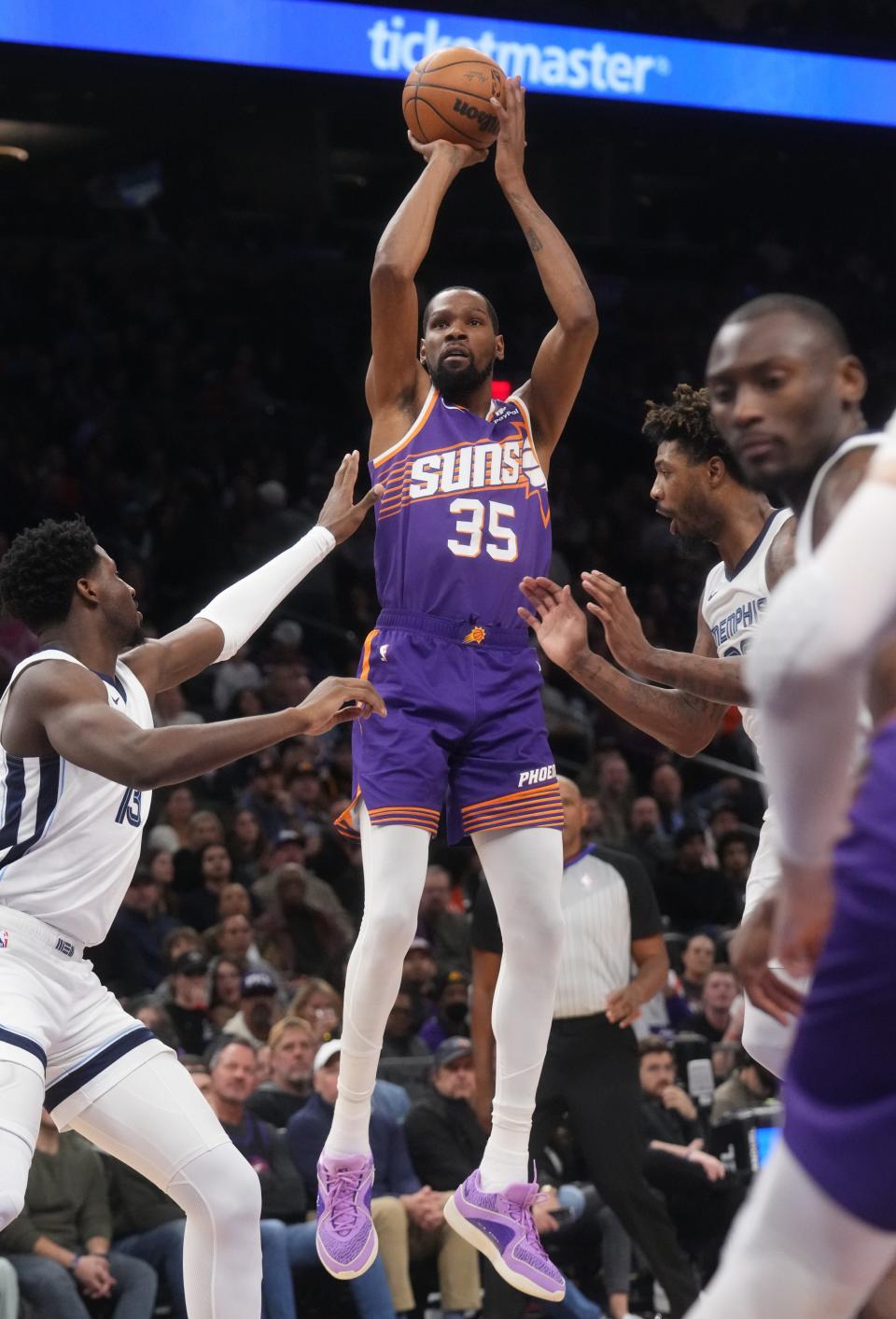 Phoenix Suns forward Kevin Durant (35) shoots the ball over Memphis Grizzlies forward Jaren Jackson Jr. (13) at the Footprint Center in Phoenix on Jan. 7, 2024.