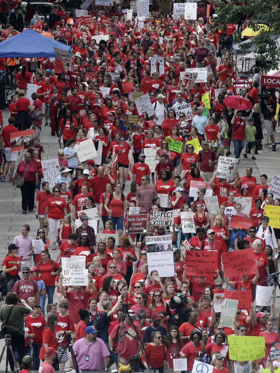 <p>Participants make their way towards the Legislative Building during a teachers rally at the General Assembly in Raleigh, N.C., Wednesday, May 16, 2018. (Photo: Gerry Broome/AP) </p>