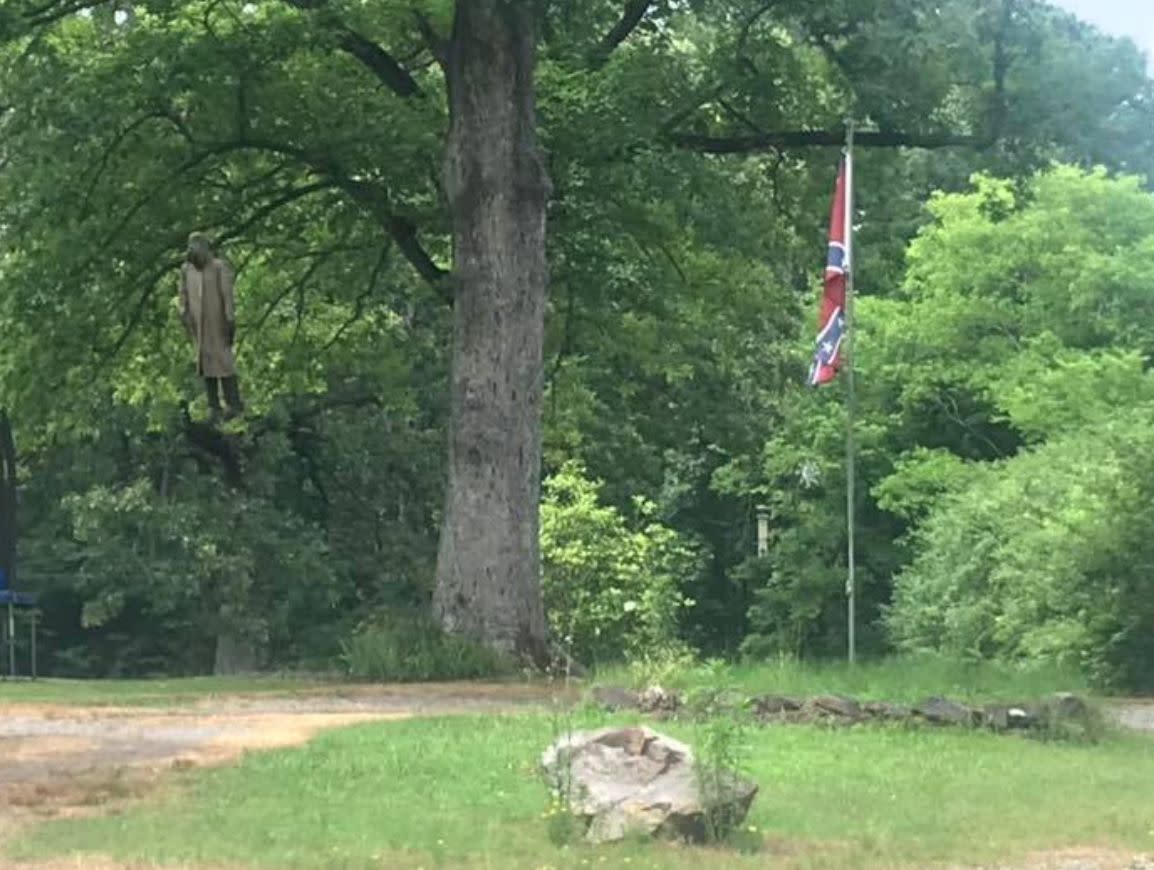 Neighbors furious after homeowners hang a Confederate flag and mannequin in their yard. 