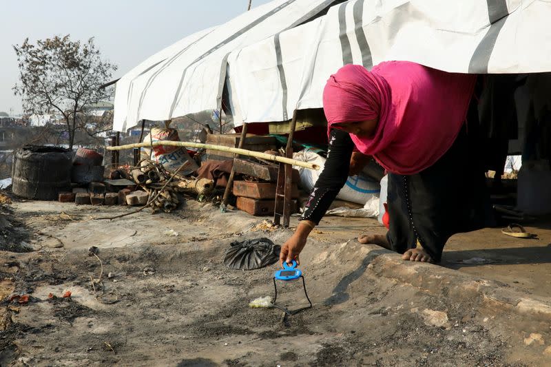 The Wider Image: 'Can't take this pain': Rohingya mother searches for son after refugee camp blaze