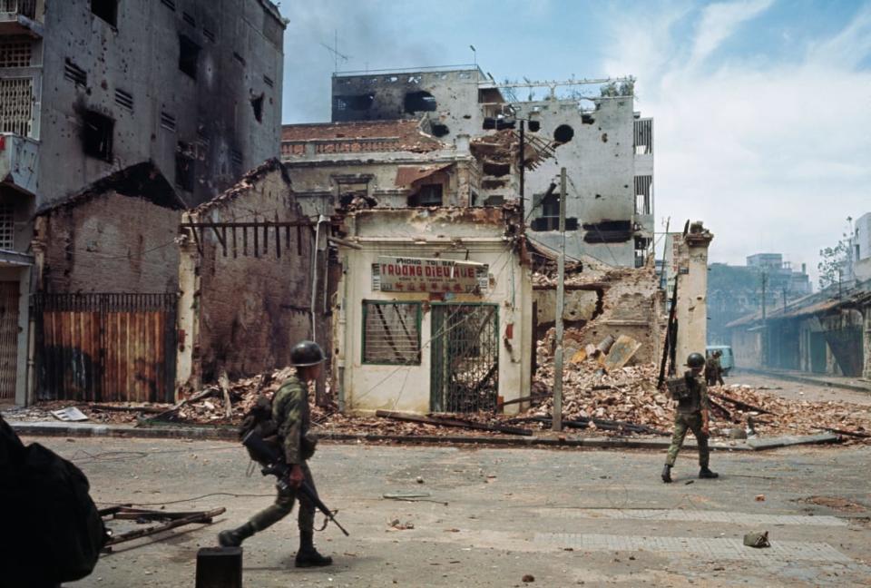 <div class="inline-image__caption"><p>Military personnel walk among destroyed buildings and empty streets following heavy fighting, part of the Tet Offensive operations of the Vietnam War, in the Cholon district of Saigon (now Ho Chi Minh City), South Vietnam, June 6, 1968.</p></div> <div class="inline-image__credit">Bettmann/Getty</div>