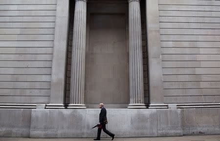 A man walks past the bank of England in London, Britain September 23, 2015. REUTERS/Neil Hall