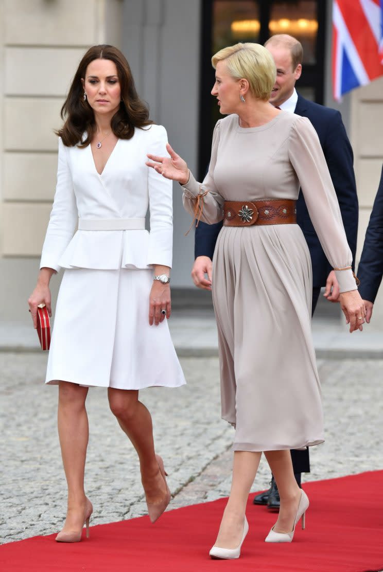 Earlier in the day, the Duchess of Cambridge wore a white ensemble by Alexander McQueen - the label behind her 2011 wedding dress