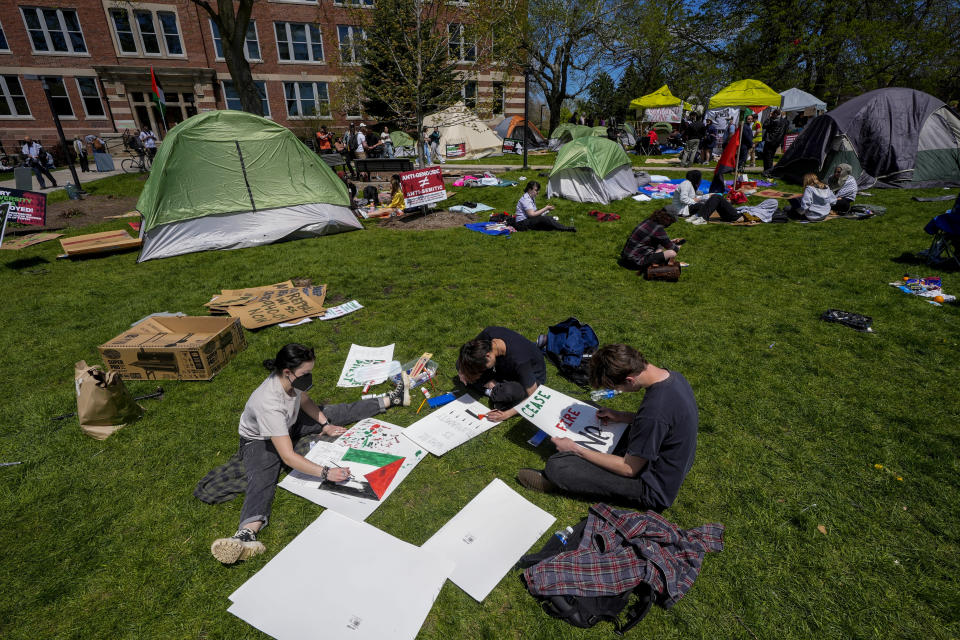 Protesters make signs in an encampment area on the University of Wisconsin-Milwaukee campus,Tuesday, April 30, 2024, in Milwaukee. The Pro-Palestinian rally is calling for the University to cut ties with Israel and for peace in Gaza. (AP Photo/Morry Gash)
