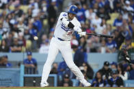 Los Angeles Dodgers designated hitter Shohei Ohtani doubles during the fourth inning of a baseball game against the Atlanta Braves in Los Angeles, Saturday, May 4, 2024. Gavin Lux scored. (AP Photo/Ashley Landis)