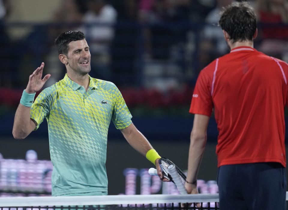 Serbia's Novak Djokovic congratulates Daniil Medvedev after he lost their semi final match of the Dubai Duty Free Tennis Championships in Dubai, United Arab Emirates, Friday, March 2, 2023. (AP Photo/Kamran Jebreili)