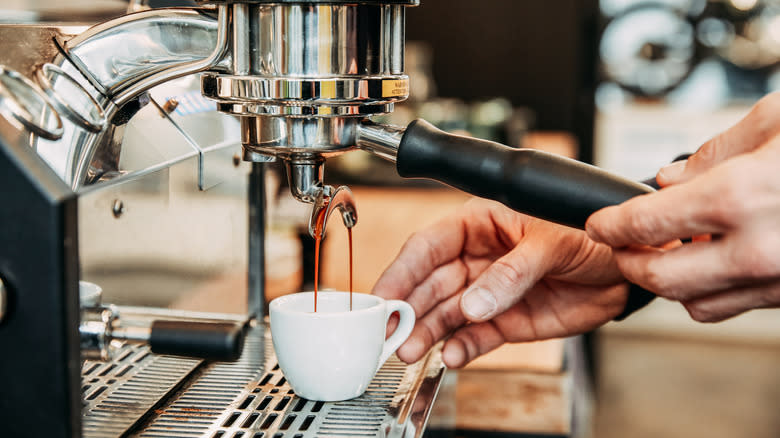 Barista pulling espresso shot