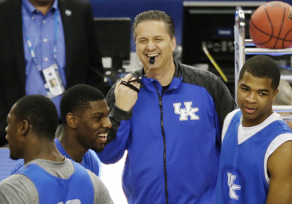 Kentucky head coach John Calipari shares a light moment with the team during practice for their NCAA Final Four tournament college basketball semifinal game Friday, April 4, 2014, in Dallas. Kentucky plays Wisconsin on Saturday, April 5, 2014. (AP Photo/Tony Gutierrez)