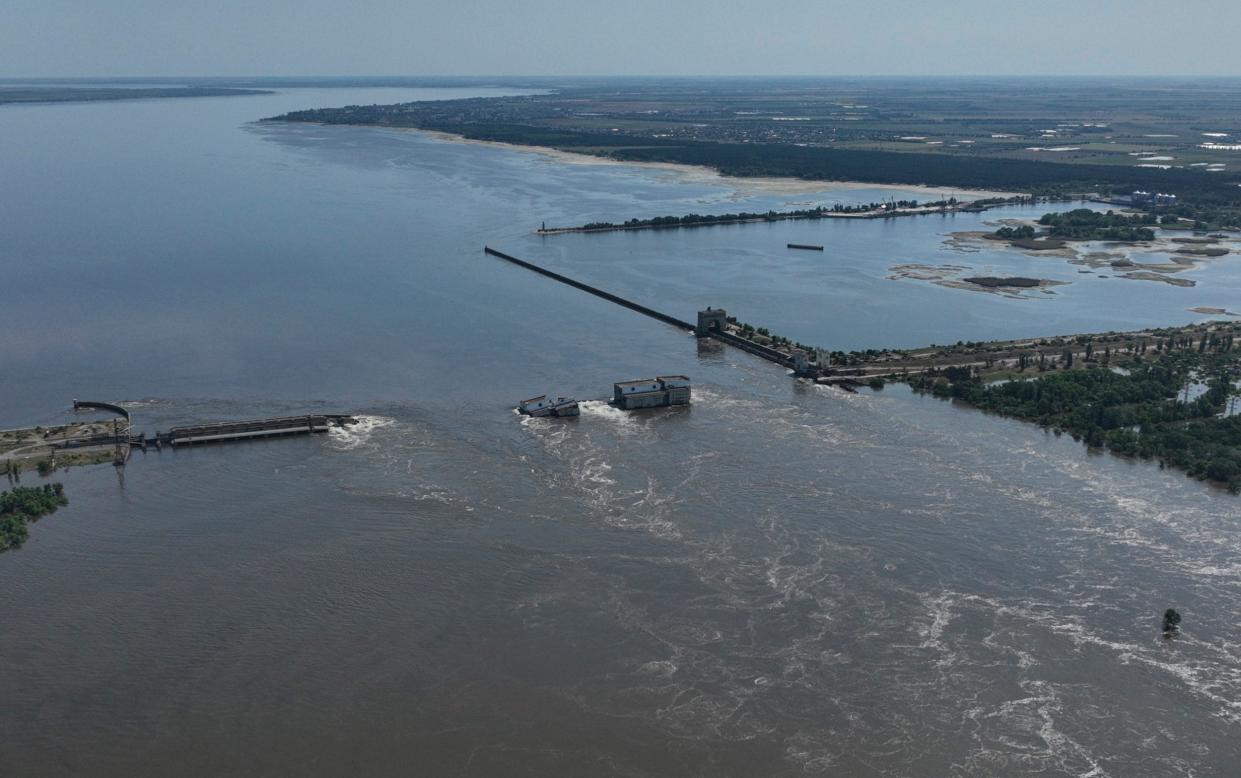 Water flows over the collapsed Kakhovka dam - AP