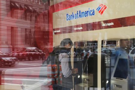 FILE PHOTO: A customer uses an ATM at a Bank of America branch in Boston, Massachusetts, U.S., October 11, 2017. REUTERS/Brian Snyder