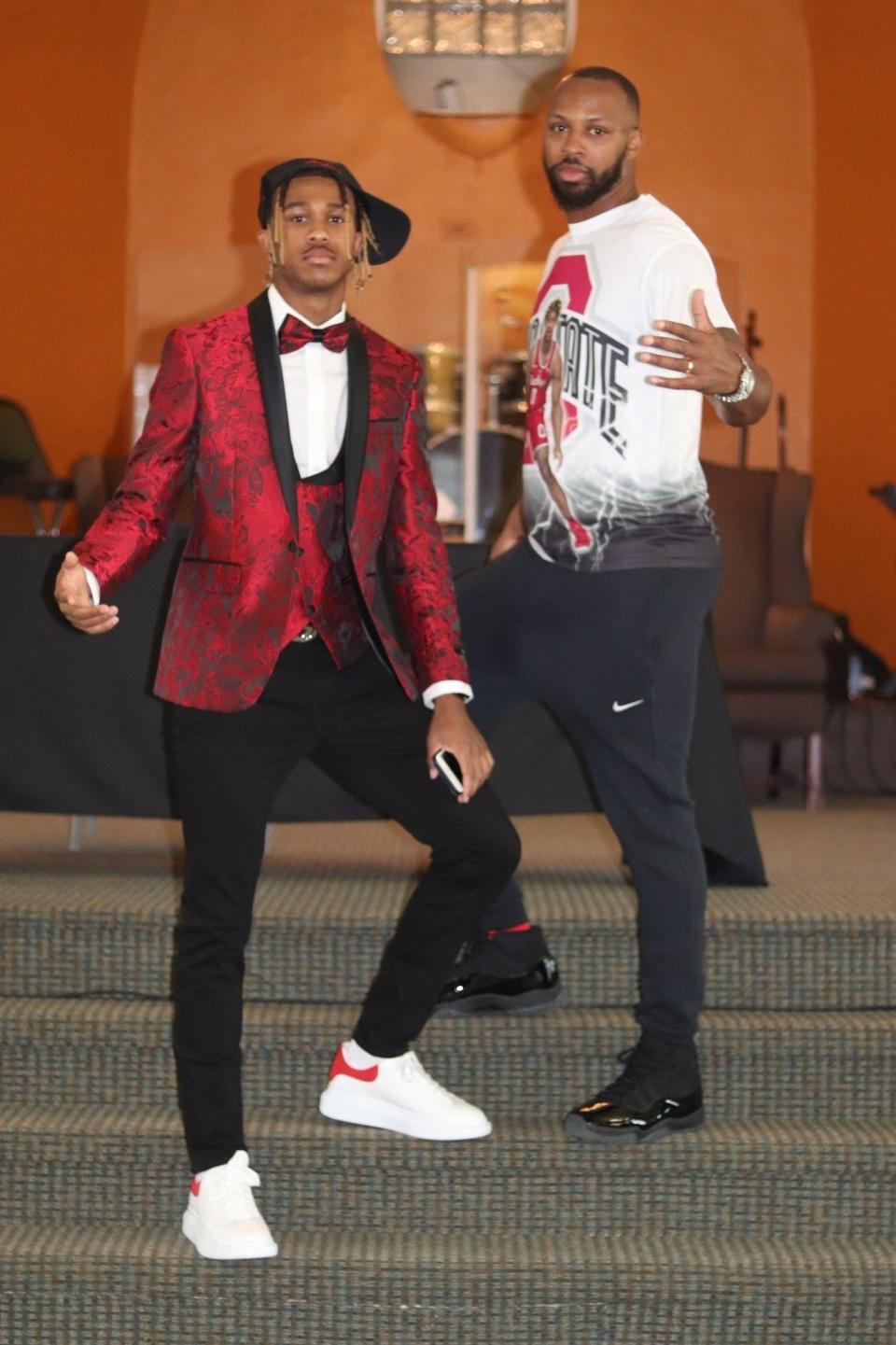 Meechie Johnson Jr. and Meechie Johnson Sr. celebrate the son signing to play for Ohio State. When Johnson Jr. was born, his dad put his basketball career on hold to focus on being a father first.
