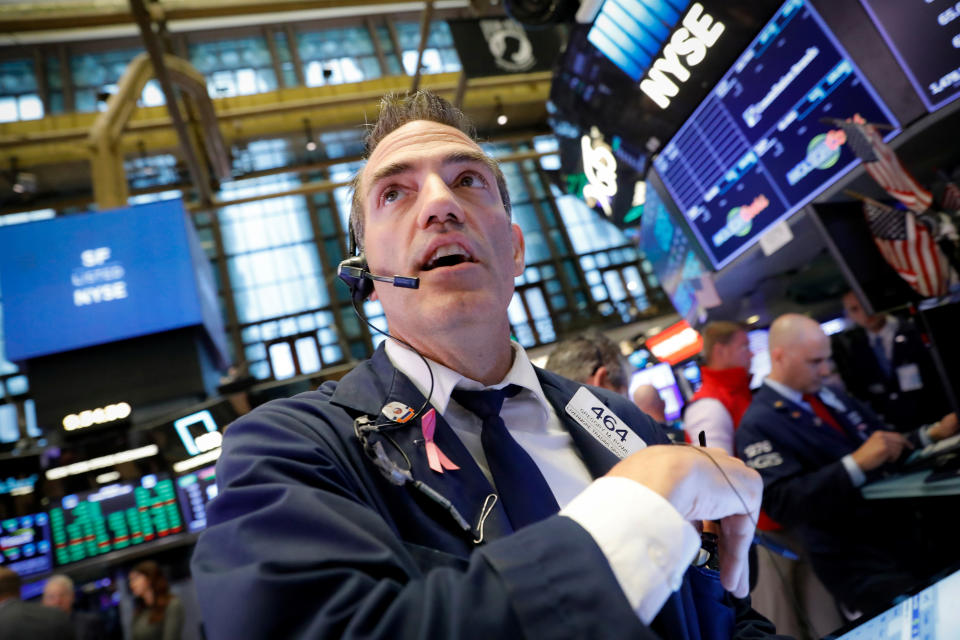 Traders work on the floor at the New York Stock Exchange (NYSE) in New York, U.S., August 6, 2019. REUTERS/Brendan McDermid