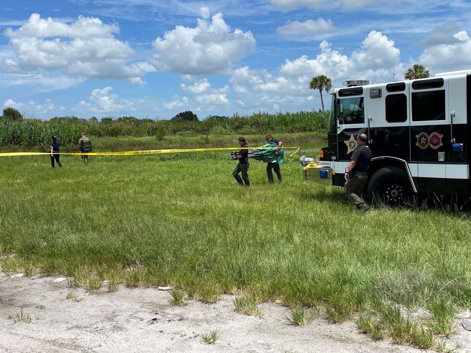 Two people were found dead in a pond Monday, July 25, 2022, in Indiantown according to the Martin County Sheriff's Office. Deputies gathered at Indiantown Avenue and Warfield Boulevard.