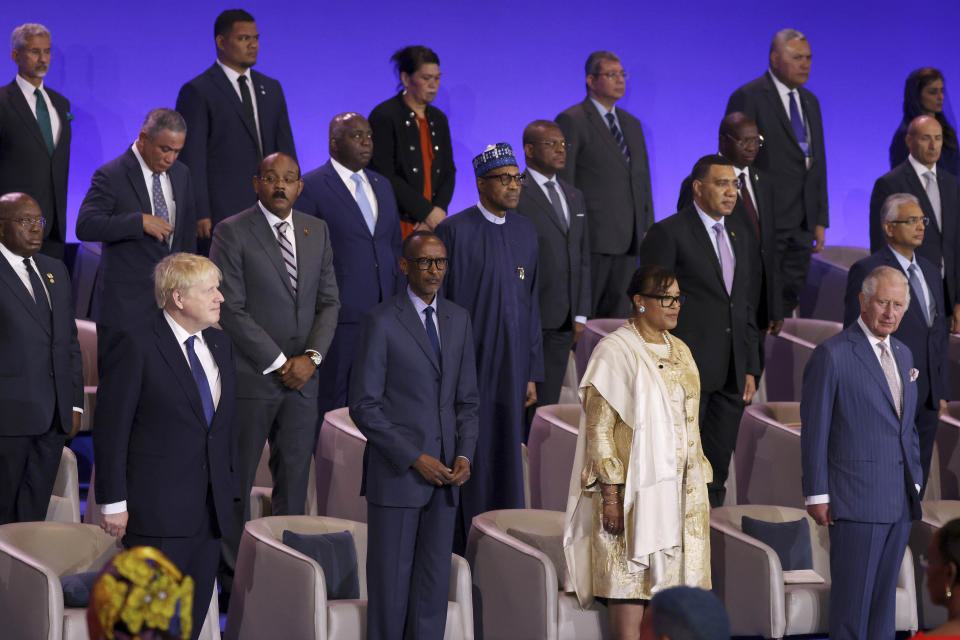 Front row from left; British Prime Minister Boris Johnson, Rwandan President Paul Kagame, Secretary-General of the Commonwealth of Nations Patricia Scotland and Britain's Prince Charles stand by their seats during the opening ceremony of the Commonwealth Heads of Government Meeting (CHOGM) on Friday, June 24, 2022 in Kigali, Rwanda. Leaders of Commonwealth nations are meeting in Rwanda Friday in a summit that promises to tackle climate change, tropical diseases and other challenges deepened by the COVID-19 pandemic. (Dan Kitwood/Pool Photo via AP)