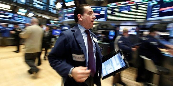 Traders work on the floor of the New York Stock Exchange (NYSE) in New York City, U.S., January 24, 2017.  REUTERS/Brendan McDermid