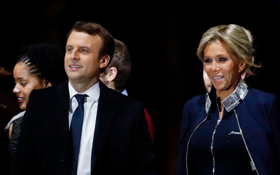 Emmanuel Macron and his wife Brigitte Trogneux at the Louvre Museum in Paris - AFP