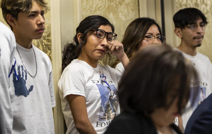RIVERSIDE, CA - OCTOBER 29, 2019: Jazmin Salcedo, sister of Diego Stolz, 13, wipes tears during a press conference announcing a lawsuit against the Moreno Valley Unified School District for the wrongful death of Stolz who was killed as a result of being bullied at Landmark Middle School on October 29, 2019 in Riverside, California. (Gina Ferazzi/Los AngelesTimes)