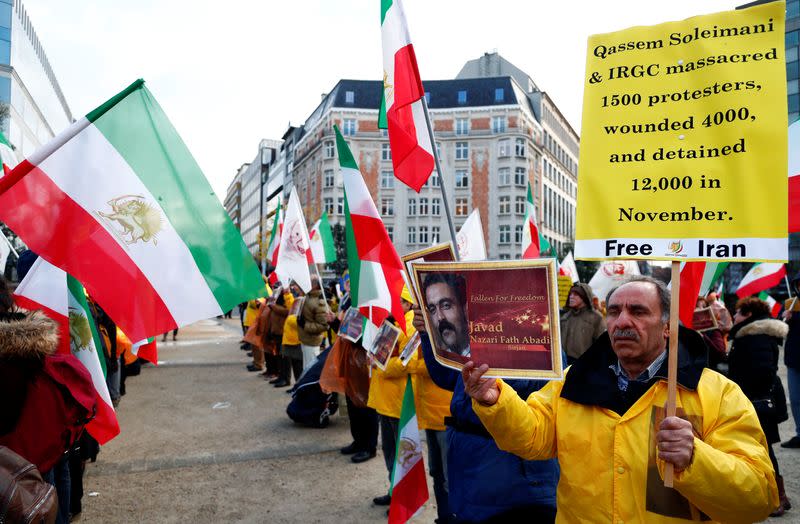 Supporters of the National Council of Resistance of Iran (NCRI) protest as European Union foreign ministers attend an emergency meeting in Brussels