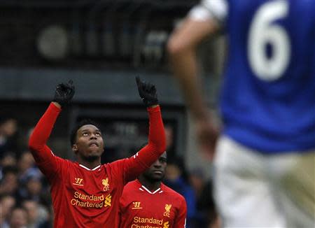 Liverpool's Daniel Sturridge (C) celebrates after scoring a goal against Everton during their English Premier League soccer match at Goodison Park in Liverpool, northern England November 23, 2013. REUTERS/Phil Noble