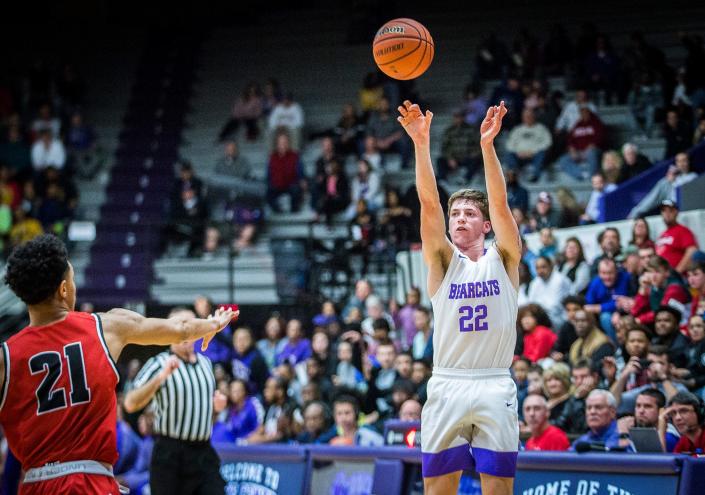 FILE -- Muncie Central&#39;s Dylan Stafford shoots past New Palestine&#39;s defense at the Muncie Fieldhouse Saturday, March 7, 2020.