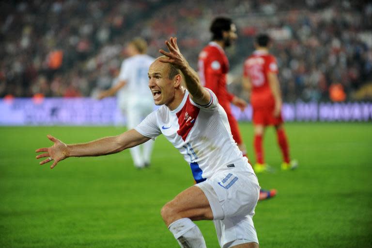 Netherlands' Arjen Robben celebrates on October 15, 2013 after a 2014 World Cup qualifying match against Turkey at the Sukru Saracoglu Stadium in Istanbul