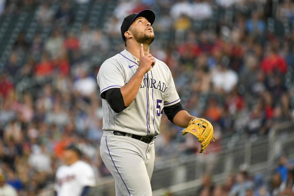 Colorado Rockies pitcher Carlos Estevez gestures as he walks to the dugout after completing the seventh inning of a baseball game against the Minnesota Twins, Saturday, June 25, 2022, in Minneapolis. (AP Photo/Craig Lassig)