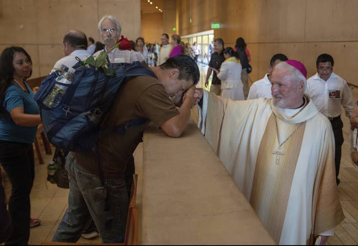 Los Angeles Auxiliary Bishop David O'Connell (right) is revered after a special mass at the Los Angeles Cathedral of Our Lady of Angels on June 24, 2018.