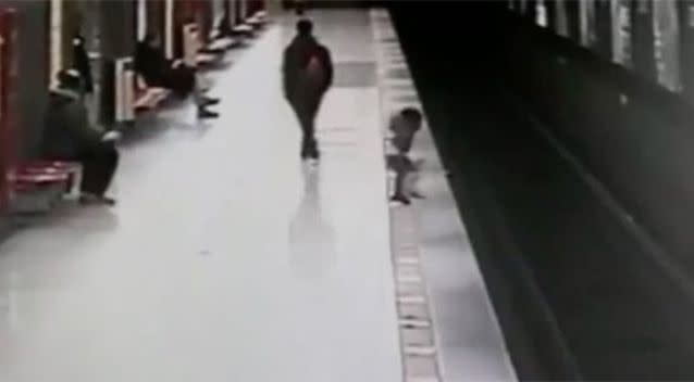 The boy ran towards the train tracks and jumped off the platform. Source: ATM Italy