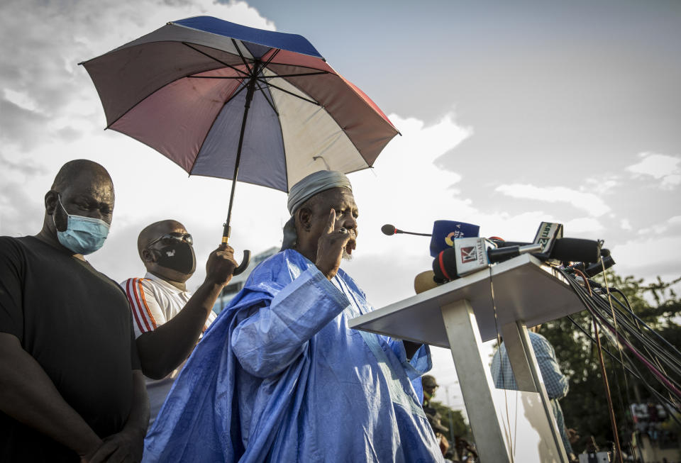 Mahmoud Dicko, an imam who has helped lead the movement against President Ibrahim Boubacar Keita, addresses Malians supporting the recent overthrow of Keita as they gather to celebrate in the capital Bamako, Mali Friday, Aug. 21, 2020. Hundreds marched in the streets of Mali's capital Friday to celebrate the overthrow of Keita, as the West African country's longtime political opposition backed the military's junta plan to eventually hand over power to a civilian transitional government. (AP Photo)