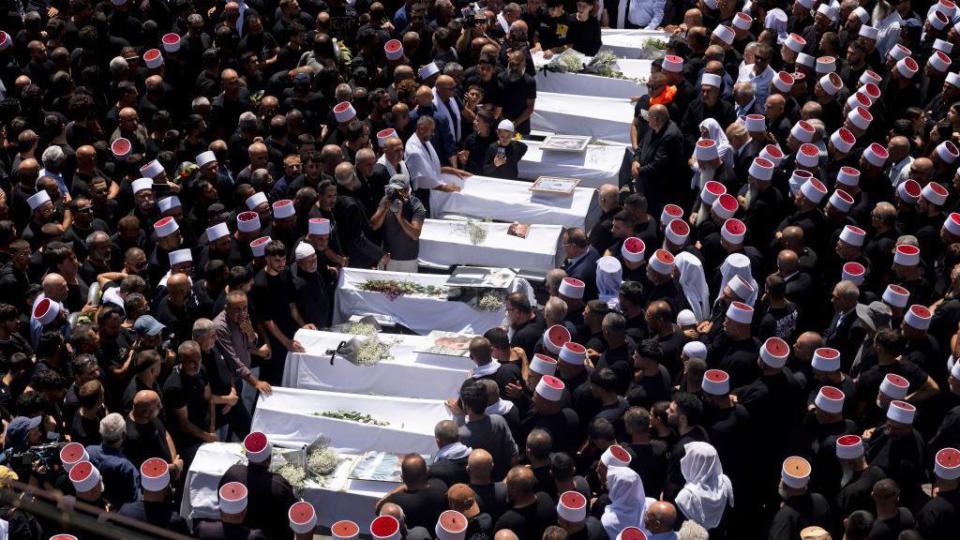 Funeral held for those killed in strike