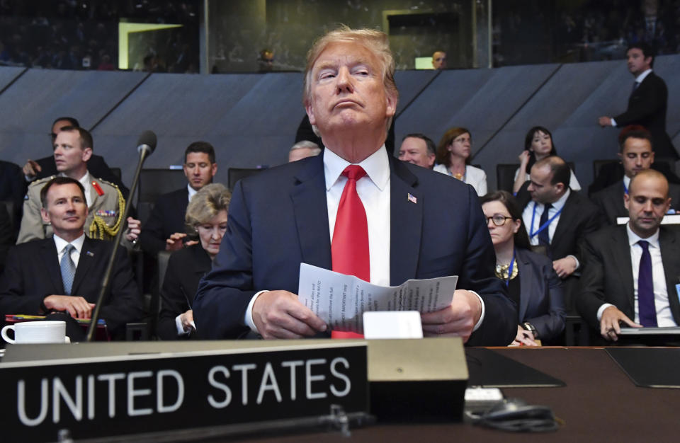 <p>President Trump attends a meeting of the North Atlantic Council during a summit of heads of state and government at NATO headquarters in Brussels on Wednesday, July 11, 2018. NATO leaders gathered in Brussels for a two-day summit to discuss Russia, Iraq and their mission in Afghanistan. (Photo: Geert Vanden Wijngaert/AP) </p>