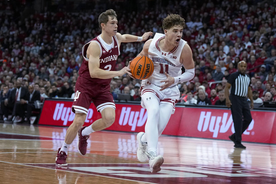 Wisconsin's Max Klesmit (11) drives against Indiana's Gabe Cupps (2) during the second half of an NCAA college basketball game Friday, Jan. 19, 2024, in Madison, Wis. (AP Photo/Andy Manis)