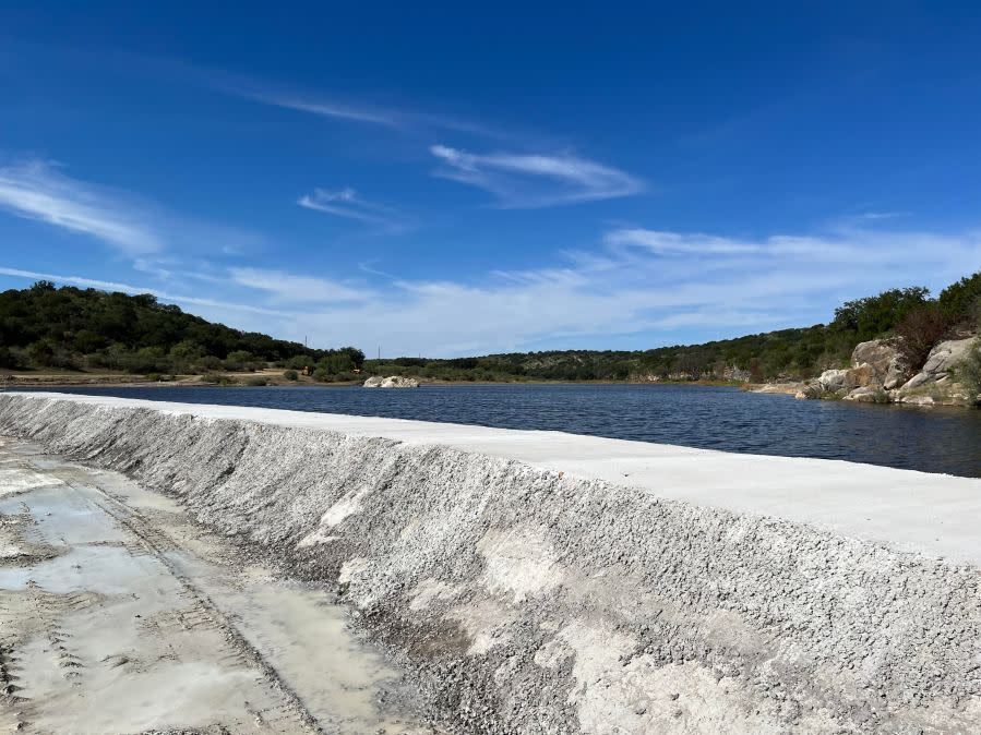 What appears to be freshly-poured concrete extends the width of the James River in Mason County -- a tributary to the Llano River, which flows into the Highlan Lakes. (KXAN Photo/David Yeomans)