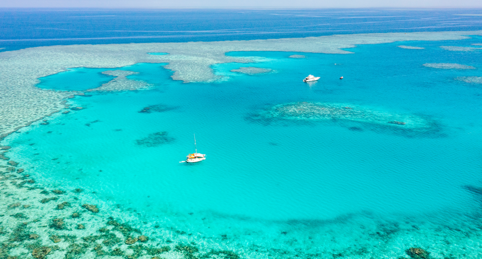 An aerial shot of the GBR with two boats on it.