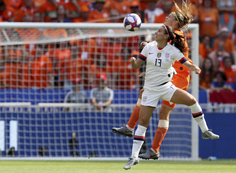 Netherlands' Anouk Dekker, top, jumps for a header with United States' Alex Morgan during the Women's World Cup final soccer match between US and The Netherlands at the Stade de Lyon in Decines, outside Lyon, France, Sunday, July 7, 2019. (AP Photo/David Vincent)