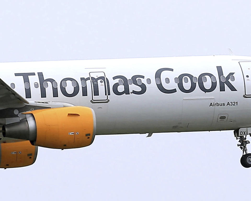 FILE - In this May 19, 2016 file photo, a Thomas Cook plane takes off in England. More than 600,000 vacationers who booked through tour operator Thomas Cook were on edge Sunday, wondering if they will be able to get home, as one of the world's oldest and biggest travel companies teetered on the edge of collapse. The debt-laden company, which confirmed Friday it was seeking 200 million pounds ($250 million) in funding to avoid going bust, was in talks with shareholders and creditors to stave off failure. (Tim Goode/PA via AP, file)