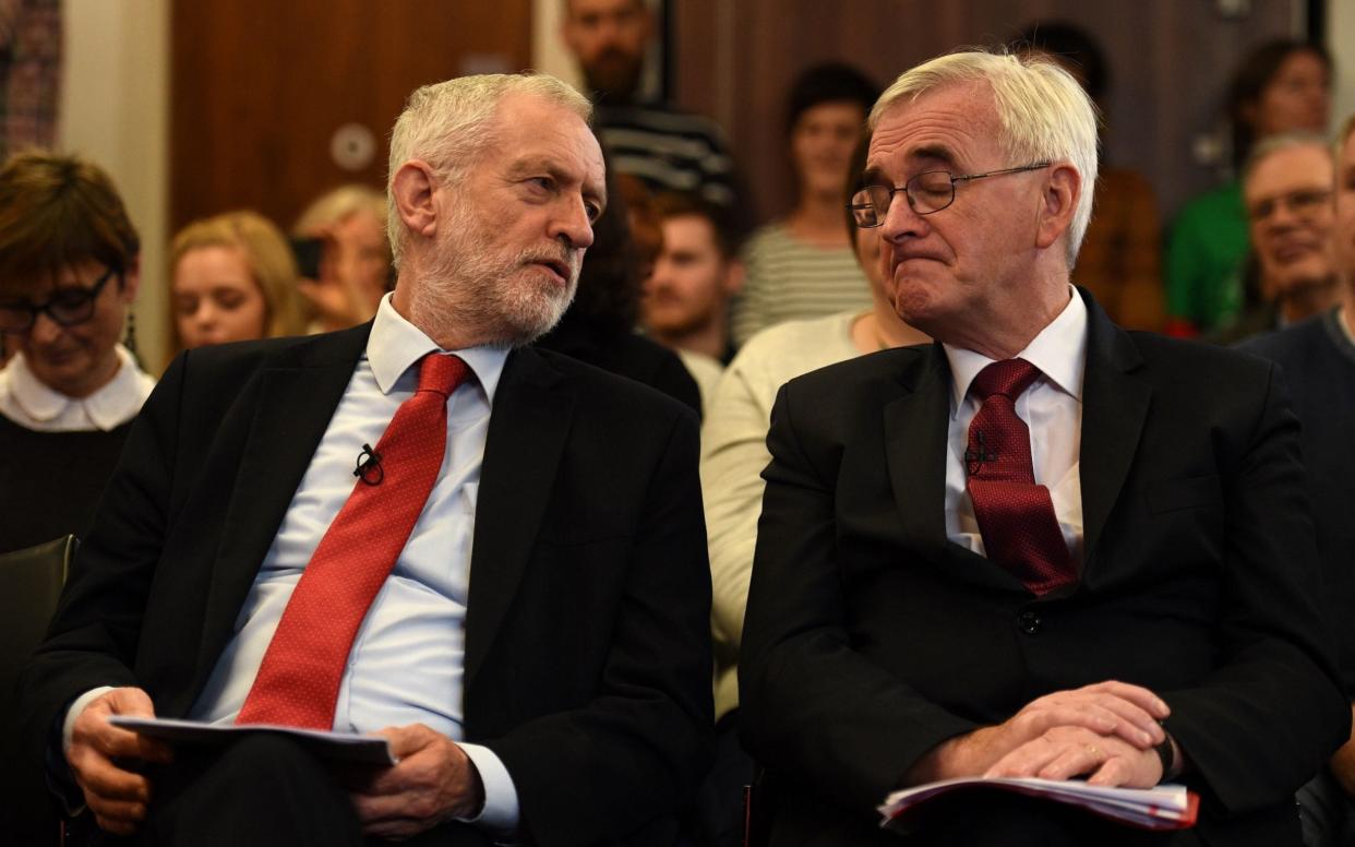 Jeremy Corbyn and John McDonnell at the event in Lancaster where they launched their British Broadband plan - AFP