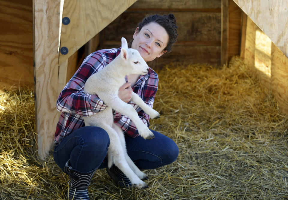 Brittney Johnson with a lamb on her sheep ranch near Underwood, Minn. Johnson is campaigning for state representative in Minnesota’s District 8A on the dual platform of “health care and farming.” (Photo: Dan Koeck for Yahoo News)