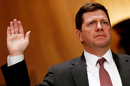 FILE PHOTO: ay Clayton is sworn in to testify at a Senate Banking, Housing and Urban Affairs Committee hearing on his nomination of to be chairman of the Securities and Exchange Commission (SEC) on Capitol Hill in Washington, U.S. March 23, 2017. REUTERS/Jonathan Ernst/File Photo