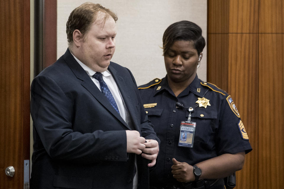 Ronald Haskell is led into the courtroom for closing arguments in his capital murder trial, Wednesday, Sept. 25, 2019, in Houston. Haskell is on trial for the 2014 shooting of six members of his ex-wife's family in suburban Houston. (Brett Coomer/Houston Chronicle via AP)
