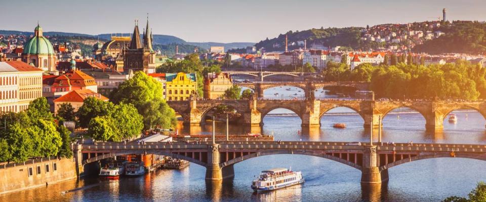 Scenic spring sunset aerial view of the Old Town pier architecture and Charles Bridge over Vltava river in Prague, Czech Republic