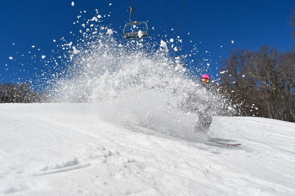 Kicking up snow at Bromley Mountain in Peru.