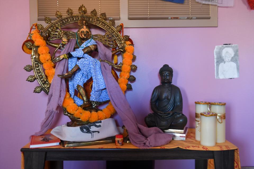 A table filled with religious deities on Wednesday, Feb. 28, 2024 at the Augustana University Morrison Commons building in Sioux Falls.