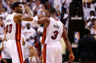 MIAMI, FL - MAY 30: Udonis Haslem #40 and Dwyane Wade #3 of the Miami Heat celebrate in the second half against the Boston Celtics in Game Two of the Eastern Conference Finals in the 2012 NBA Playoffs on May 30, 2012 at American Airlines Arena in Miami, Florida. NOTE TO USER: User expressly acknowledges and agrees that, by downloading and or using this photograph, User is consenting to the terms and conditions of the Getty Images License Agreement. (Photo by Mike Ehrmann/Getty Images)