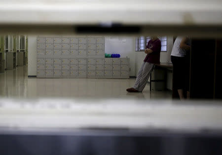 FILE PHOTO: Detainees are seen through a hatch at the Tokyo detention center which is part of Tokyo Regional Immigration Bureau in Tokyo, Japan, December 2, 2015. REUTERS/Yuya Shino/File Photo