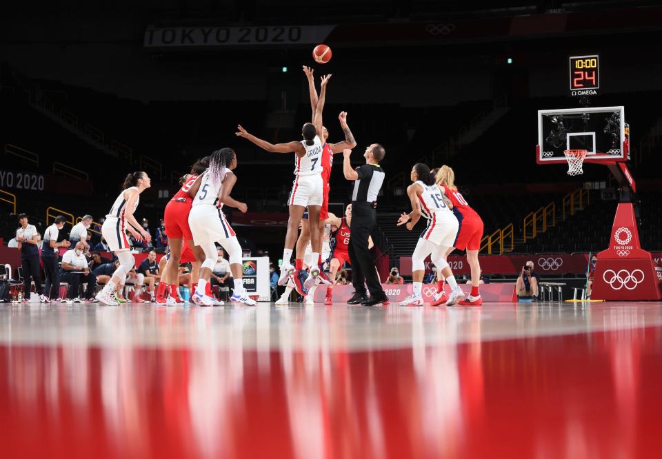 Team USA's Brittney Griner jumps for a tip against France to start a game at the Tokyo Olympics.