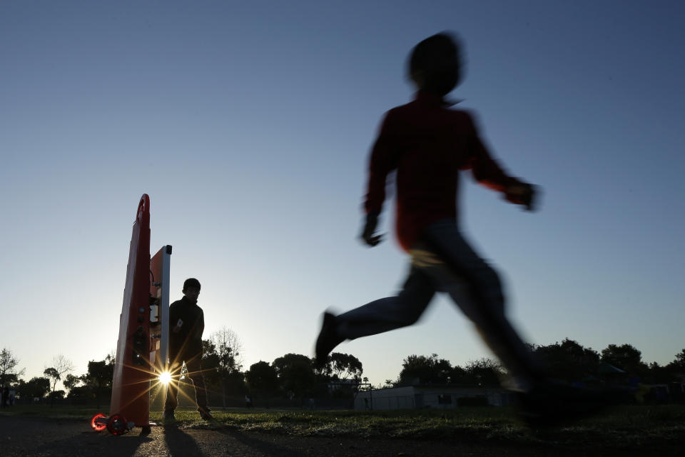 In this March 14, 2014 picture, students take part in an early morning running program at an elementary school in Chula Vista, Calif. Amid alarming national statistics showing an epidemic in childhood obesity, hundreds of thousands of students across the country are being weighed and measured. The Chula Vista Elementary School District is being touted as a model for its methods that have resulted in motivating the community to take action. (AP Photo/Gregory Bull)