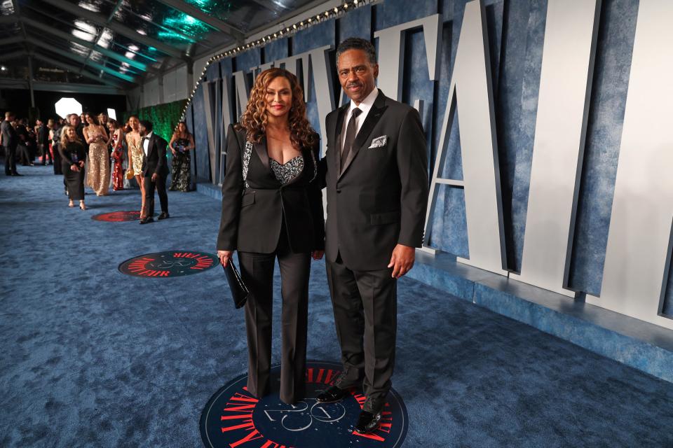 Tina Knowles-Lawson and Richard Lawson pose in black tuxedos on the blue carpet of the Vanity Fair party. (Cindy Ord/VF23 / Getty Images for Vanity Fair)
