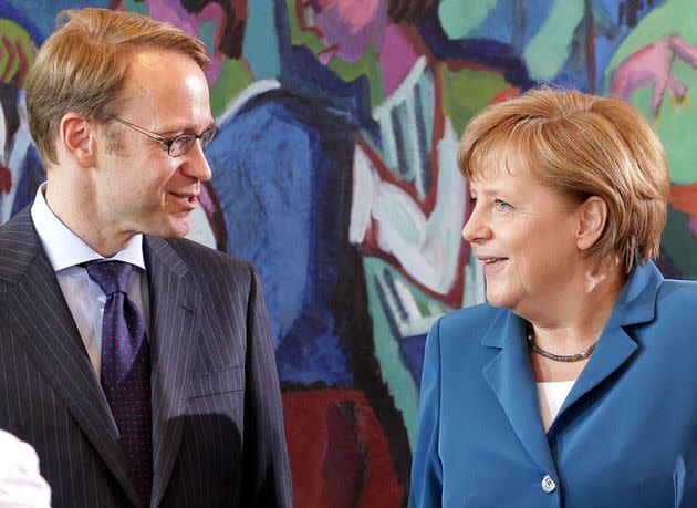 German Chancellor Angela Merkel (R) speaks with President of the German Federal Bank (Deutsche Bundesbank) Jens Weidmann before the cabinet meeting in Berlin on June 27, 2012. Merkel insisted in a speech to lawmakers that there were 