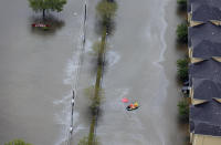 <p>A boat navigates through floodwaters from Tropical Storm Harvey on Tuesday, Aug. 29, 2017, in Houston. With its flood defenses strained, the crippled city of Houston anxiously watched dams and levees Tuesday to see if they would hold until the rain stops, and meteorologists offered the first reason for hope â a forecast with less than an inch of rain and even a chance for sunshine. (Photo: David J. Phillip/AP) </p>
